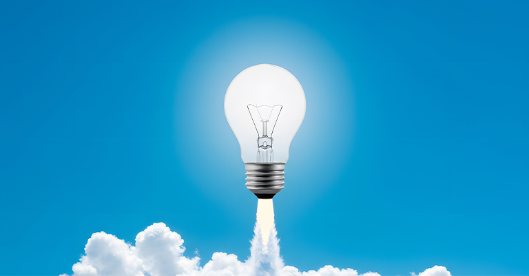 NeuralNetwork_5 • Andrew Roche AI A lightbulb blasting off like a rocket into the sky, leaving a trail of clouds behind against a bright blue background.